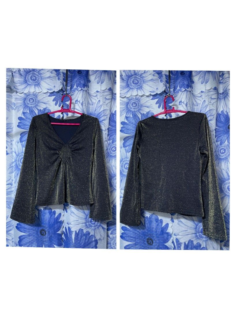 Sparkly Black V-Neck Long Sleeve Top (Category: Longsleeves) located in Manila. Submitted by arimad.clo (Listing ID 1471169285, Image 1). Description: - Color: Black with metallic gold shimmer - Neckline: V-neck with trendy gathered twist detail - Sleeves: Flared bell sleeves - Fit: Stretchy, comfortable material with a straight back hem - Occasion: Perfect for casual outings or evening events.