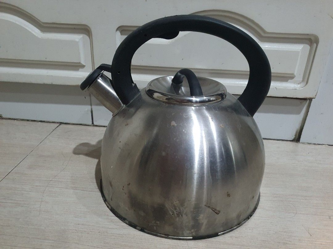 Stainless Steel Tea Kettle with Black Handle (Category: Kettles & Airpots) located in Paranaque City. Submitted by nicessities (Listing ID 1471123249, Image 1). Description: - Material: Durable stainless steel with black plastic handle - Design: Classic rounded body and spout with matching lid and center knob - Condition: Pre-owned with minor water marks and small spots of wear from regular kitchen use - Perfect for daily brewing and boiling Purc