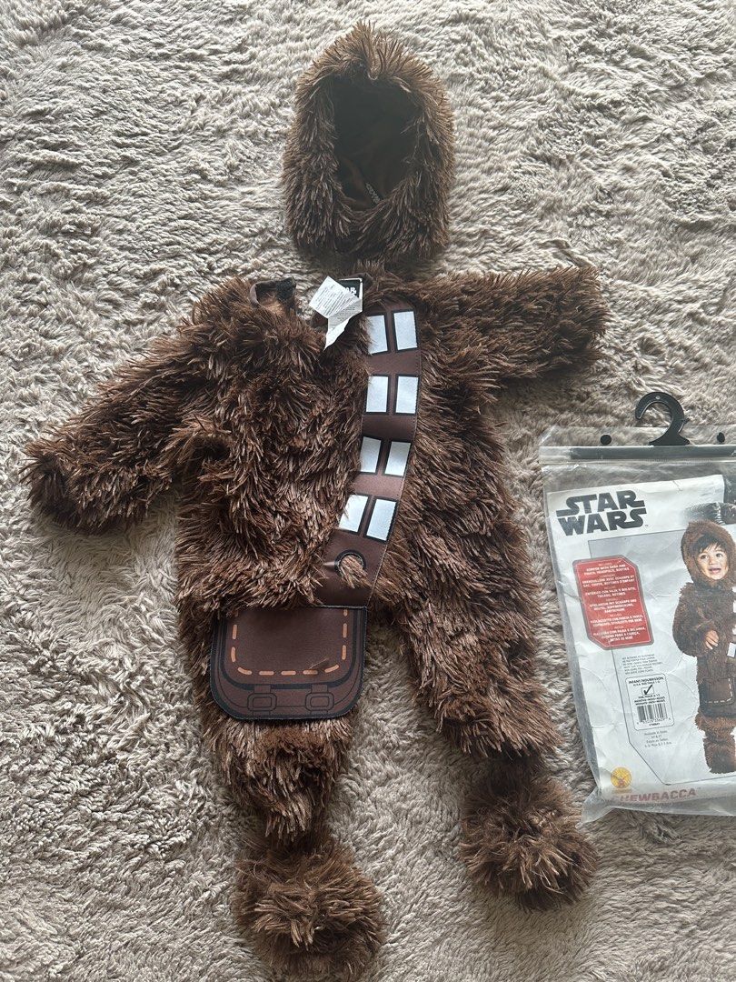 Star Wars Chewbacca Infant Costume (Category: Babies & Kids Fashion) located in Mandaluyong City. Submitted by kacbriz (Listing ID 1471171035, Image 1). Description: Star Wars Chewbacca costume for infants, size 6 to 12 months. Includes fuzzy brown jumpsuit, attached sash, bag detail, and separate headpiece with fluffy fur. Original packaging bag included. Soft material, warm style for babies. Halloween costume.