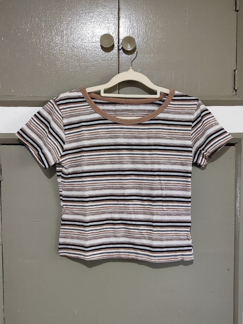 Striped Ringer Crop Top Brown White Black (Category: Shirts) located in Quezon City. Submitted by thestargazerspica (Listing ID 1471150435, Image 3). Description: - Color: Brown, white, and black stripes - Style: Ringer crop top with short sleeves - Details: Contrast brown collar trim, horizontal stripe pattern - Material: Lightweight and comfortable fabric - Fit: Easy to pair with high-waisted jeans or skirts - Condition: Clean inside and out, r