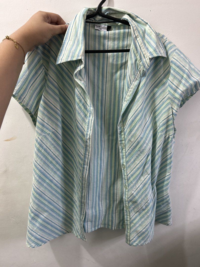 Striped Short-Sleeve Button-Down Shirt (Category: Shirts) located in Manila. Submitted by ardol (Listing ID 1471146348, Image 1). Description: can fit to s- semi large - Style: Short-sleeve button-down shirt - Colors & Pattern: Green and blue stripes with unique directional side panels - Details: Collar neckline and front button closure - Fabric: Lightweight and ideal for warm weather - Condition: Clean and ready to wear.
