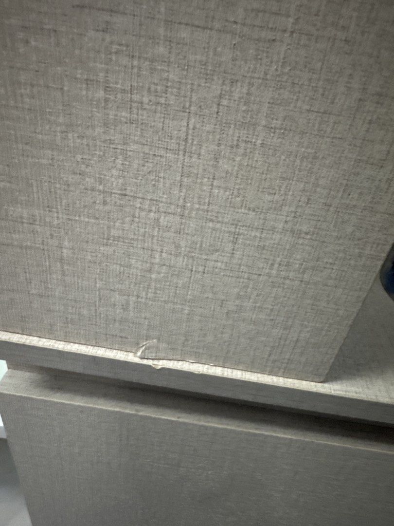 Study table Light Grey Faux Wood Study Desk (Category: Office Furniture & Fixtures) located in Pasig City. Submitted by cecilececile4361 (Listing ID 1471149564, Image 3). Description: - Textured light grey faux wood desk surface - Structurally sound particle board build - Honest condition: noticeable surface wear, peeling laminate, tape residue, and chipped corners - Visible fastener nails on the rear panel - Perfect budget table for students, WF