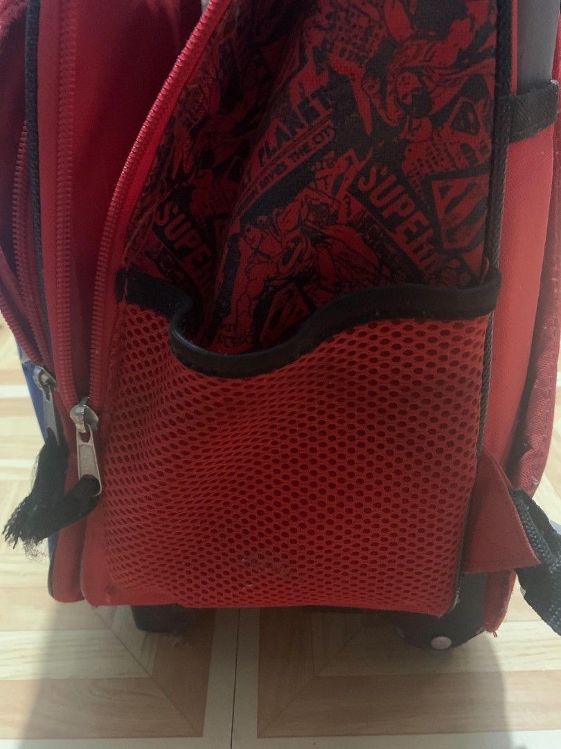 Superman Kids Rolling Backpack with Detachable Lunch Bag (Category: Babies & Kids Fashion) located in Manila. Submitted by dizonnixni94357 (Listing ID 1471168987, Image 3). Description: - Superman rolling backpack with matching lunch bag - Vibrant comic book graphics and classic superhero logo badge - Retractable pull handle, adjustable shoulder straps, and dual side mesh pockets - Wipe-clean interior lining for easy maintenance - Condition: Red 