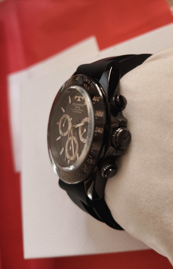 Technos Swiss TGM815 Chronograph Watch (Category: Men's Watches) located in Angono. Submitted by allenpaul26 (Listing ID 1471138304, Image 2). Description: - Brand/Model: Technos Swiss Chronograph (TGM815) - Material: All stainless steel case with sleek black finish - Dial & Bezel: Black dial with three sub-dials and tachymeter bezel - Strap: Comfortable black rubber strap with secure buckle closure - Water Resistance: Up to 10 ATM / 10 bar - Con