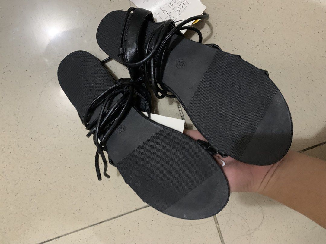 Terranova Black Strappy Gladiator Sandals Size 37 (Category: Flats & Sandals) located in Manila. Submitted by batibal (Listing ID 1471225305, Image 2). Description: Black strappy sandals from Terranova. Size 37. Flat soles with textured grip underneath. Thin wrap-around ankle straps with buckle closure at the back. Tag still attached, never worn. Super versatile style for summer outfits or casual days out..
