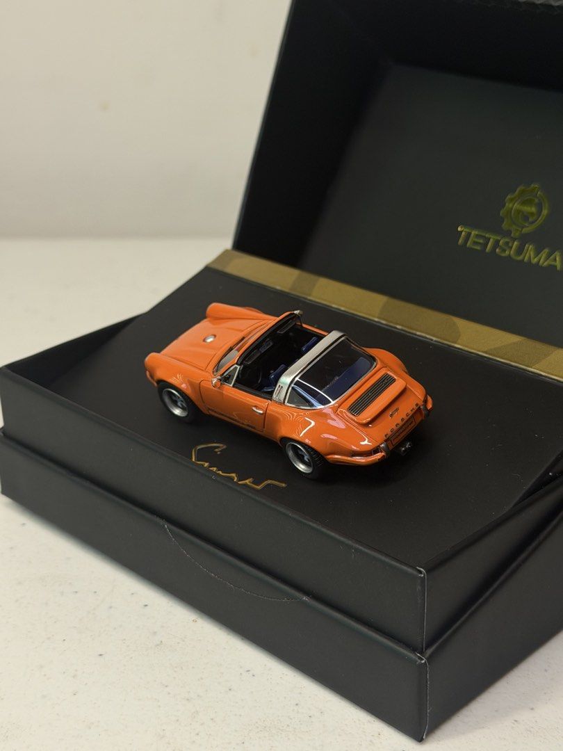 Tetsuma Singer Porsche Targa 1:64 Orange (Category: Vehicle & Diecast Models) located in Manila. Submitted by kelvs1435 (Listing ID 1471188239, Image 3). Description: - Brand: Tetsuma - Scale: 1:64 Porsche Targa in bright orange - Interior: Detailed with blue houndstooth seats - Special Feature: Singer signature on the base - Packaging: Premium display box with gold branding included.