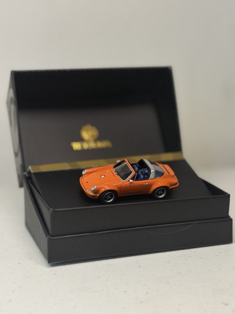 Tetsuma Singer Porsche Targa 1:64 Orange (Category: Vehicle & Diecast Models) located in Manila. Submitted by kelvs1435 (Listing ID 1471188239, Image 1). Description: - Brand: Tetsuma - Scale: 1:64 Porsche Targa in bright orange - Interior: Detailed with blue houndstooth seats - Special Feature: Singer signature on the base - Packaging: Premium display box with gold branding included.