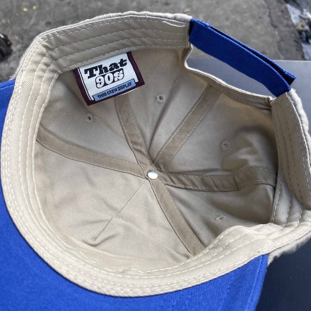 TH90 Crew That 90s Distressed Baseball Cap Tan Blue (Category: Caps & Hats) located in Quezon City. Submitted by capsanywhere (Listing ID 1471193296, Image 3). Description: - Brand: That 90s (TH90 Crew Display tag) - Color: Tan and blue - Design: Front woven patch with TH90 Crew graphics - Details: Trendy distressed accents on the brim and crown - Closure: Adjustable blue strap with TH90 embroidery - Condition: Clean overall, ready to wear.
