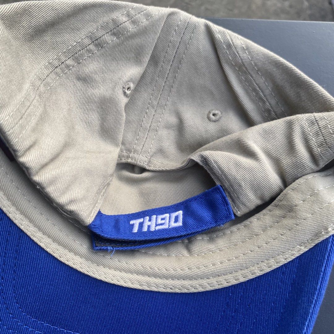 TH90 Crew That 90s Distressed Baseball Cap Tan Blue (Category: Caps & Hats) located in Quezon City. Submitted by capsanywhere (Listing ID 1471193296, Image 2). Description: - Brand: That 90s (TH90 Crew Display tag) - Color: Tan and blue - Design: Front woven patch with TH90 Crew graphics - Details: Trendy distressed accents on the brim and crown - Closure: Adjustable blue strap with TH90 embroidery - Condition: Clean overall, ready to wear.