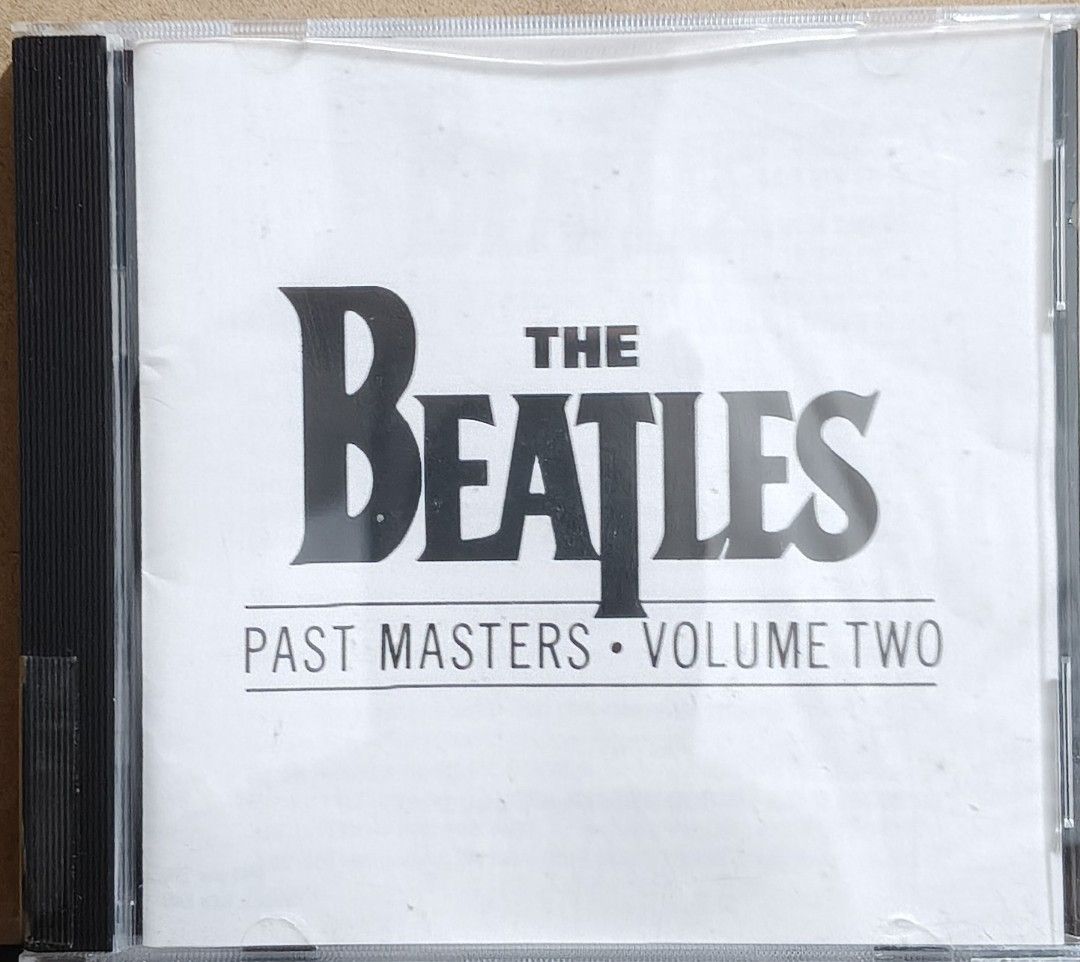 The Beatles Past Masters Volume Two CD Album (Category: CDs & DVDs) located in Manila. Submitted by ruelcabrer77078 (Listing ID 1471286776, Image 1). Description: Original The Beatles Past Masters Volume Two audio CD, compilation from 1988. Includes 15 tracks like Day Tripper, Hey Jude, and Let It Be. Manufactured and distributed by EMI Philippines, Inc. Case and inserts included with handwritten notes on the back inlay. Disc includes track listi