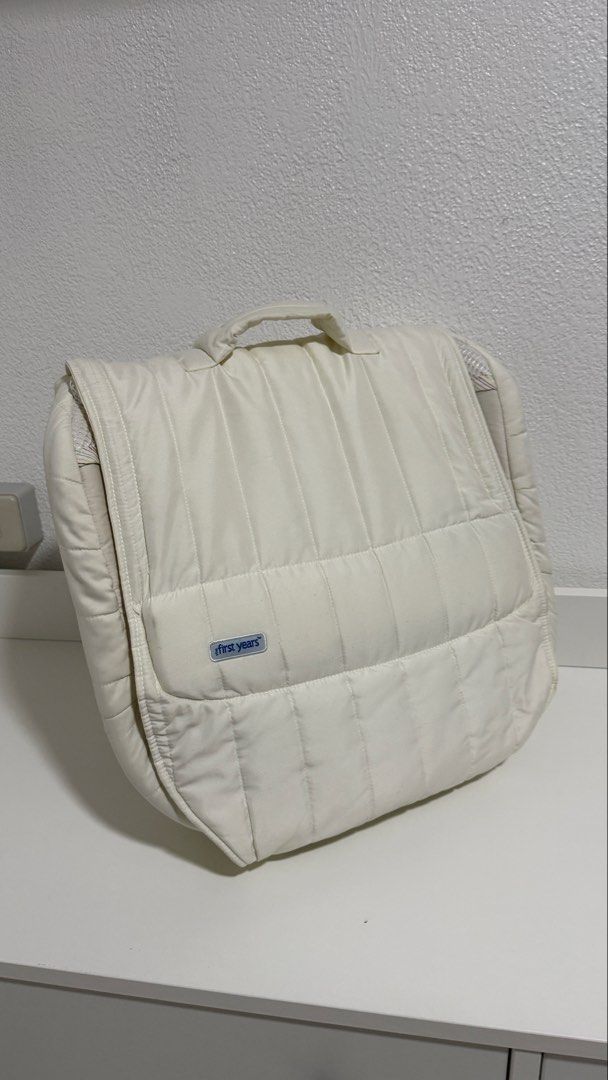 The First Years Portable Infant Sleeper (Category: Cots & Cribs) located in Santa Cruz. Submitted by jlchua (Listing ID 1471249341, Image 1). Description: - Brand: The First Years - Color: Quilted off-white - Design: Folds down easily into a compact carry bag with handles for travel - Comfort & Safety: Breathable mesh sides to keep baby cool and secure padded sides - Extra Feature: Built-in nightlight unit located at the head - Convenience: Pops 