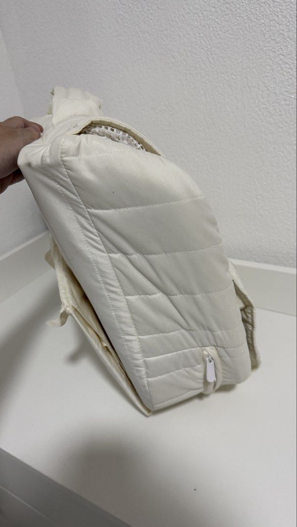 The First Years Portable Infant Sleeper (Category: Cots & Cribs) located in Santa Cruz. Submitted by jlchua (Listing ID 1471249341, Image 2). Description: - Brand: The First Years - Color: Quilted off-white - Design: Folds down easily into a compact carry bag with handles for travel - Comfort & Safety: Breathable mesh sides to keep baby cool and secure padded sides - Extra Feature: Built-in nightlight unit located at the head - Convenience: Pops 
