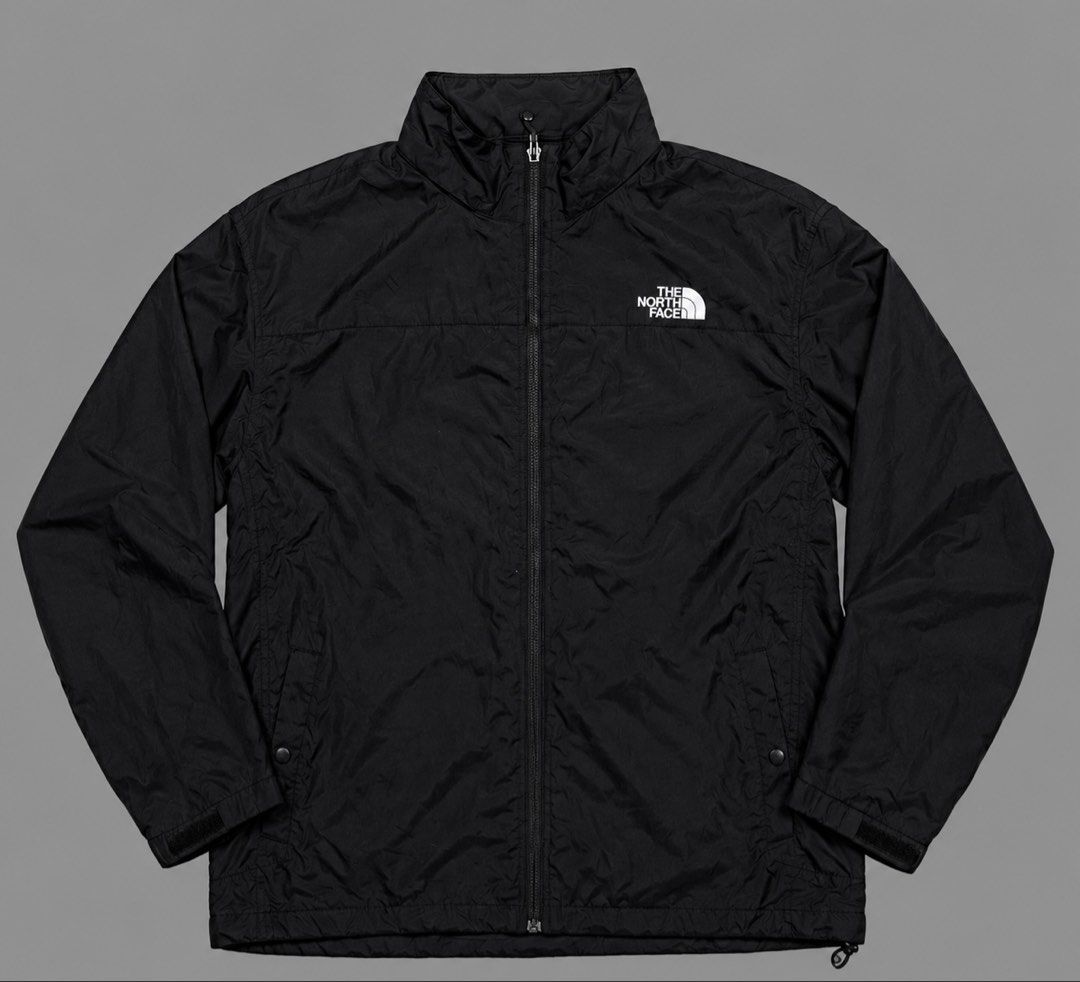 The North Face Black Windbreaker Jacket XL (Category: Coats, Jackets and Outerwear) located in Kidapawan. Submitted by thrift_gem (Listing ID 1471235521, Image 1). Description: - Brand: The North Face - Color: Classic Black with Contrast White Logos (Chest & Back) - Size: XL - Material: Lightweight with breathable mesh interior lining - Closure: Full zip front - Pockets: Two secure zippered hand pockets - Adjustability: Drawcord at hem and collar