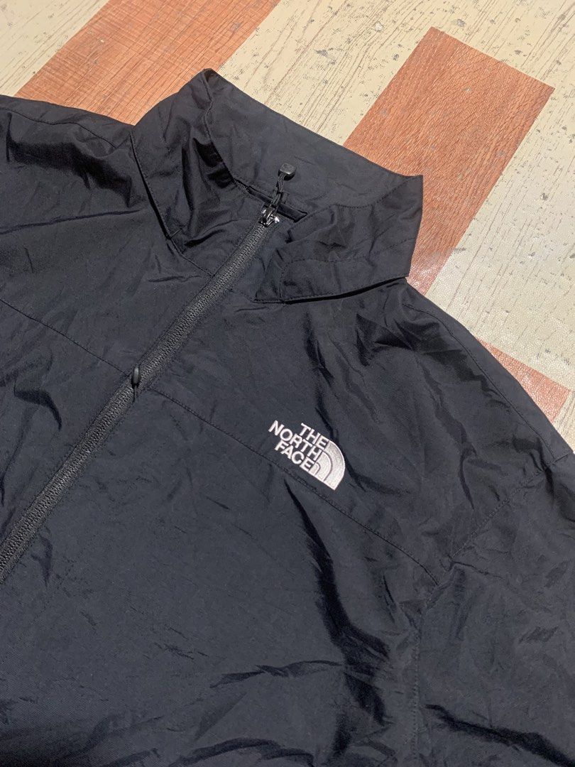 The North Face Black Windbreaker Jacket XL (Category: Coats, Jackets and Outerwear) located in Kidapawan. Submitted by thrift_gem (Listing ID 1471235521, Image 2). Description: - Brand: The North Face - Color: Classic Black with Contrast White Logos (Chest & Back) - Size: XL - Material: Lightweight with breathable mesh interior lining - Closure: Full zip front - Pockets: Two secure zippered hand pockets - Adjustability: Drawcord at hem and collar
