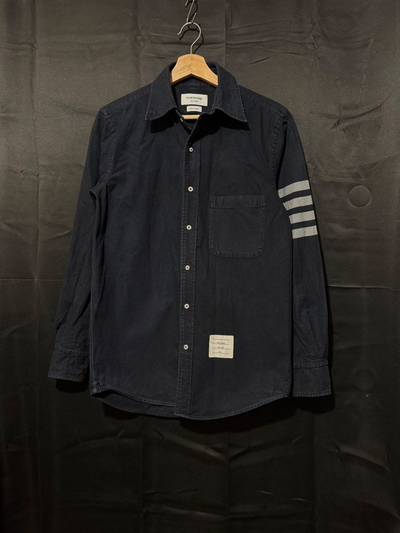 Thom Browne Black Buttondown Longsleeve For Men (Category: Formal Shirts) located in Lapu Lapu. Submitted by kalyengkalat01 (Listing ID 1471153930, Image 1). Description: Thom Browne Black Buttondown For Men — Regular Fit , Oxford Cotton Size : 1 ( Small ) Dimes : 19 Width 28 Length Color rate : 9 out of 10 —————————— Authentic | Legit 💯 Condition : Lightly Used / Presentable ‼️ ISSUE : Missing Collar Button 🚶‍♂️ Washed & Ready to Wear.