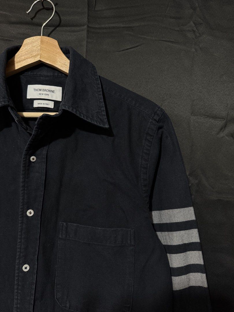 Thom Browne Black Buttondown Longsleeve For Men (Category: Formal Shirts) located in Lapu Lapu. Submitted by kalyengkalat01 (Listing ID 1471153930, Image 2). Description: Thom Browne Black Buttondown For Men — Regular Fit , Oxford Cotton Size : 1 ( Small ) Dimes : 19 Width 28 Length Color rate : 9 out of 10 —————————— Authentic | Legit 💯 Condition : Lightly Used / Presentable ‼️ ISSUE : Missing Collar Button 🚶‍♂️ Washed & Ready to Wear.