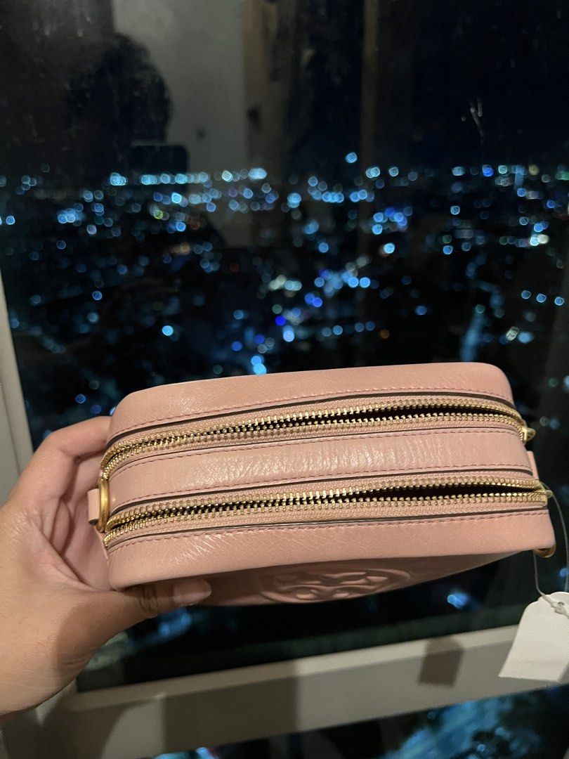 Tory Burch Pink Leather Crossbody Bag (Category: Accessory Holder, Box & Organizers) located in Imus. Submitted by ann__xoxo (Listing ID 1471179423, Image 3). Description: - Brand: Tory Burch - Color: Pink - Material: Genuine leather with embossed front logo - Condition: Brand new with tags in original packaging - Hardware: Gold-tone - Strap: Adjustable - Compartments: Double zip closure + external back slip pocket - Size: Great for everyday use.