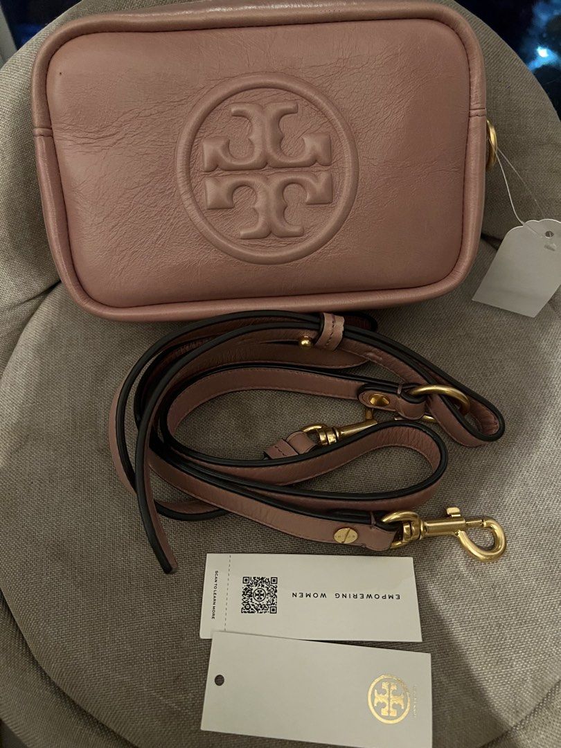 Tory Burch Pink Leather Crossbody Bag (Category: Accessory Holder, Box & Organizers) located in Imus. Submitted by ann__xoxo (Listing ID 1471179423, Image 2). Description: - Brand: Tory Burch - Color: Pink - Material: Genuine leather with embossed front logo - Condition: Brand new with tags in original packaging - Hardware: Gold-tone - Strap: Adjustable - Compartments: Double zip closure + external back slip pocket - Size: Great for everyday use.