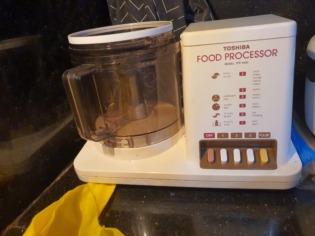 Toshiba Food Processor Model TFP-1400 with Accessories (Category: Juicers, Blenders & Grinders) located in Paranaque City. Submitted by nicessities (Listing ID 1471124033, Image 1). Description: - Brand: Toshiba TFP-1400 Food Processor **trusted brand quality product* - Functions: Multiple speed settings and pulse function for versatile kitchen tasks - Capabilities: Ideal for chopping, slicing, shredding, and mixing - Inclusions: Main motorized b