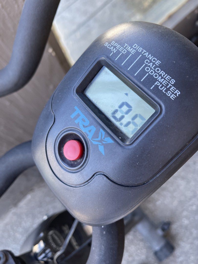 Trax Cadence 2.0 Exercise Bike (Category: Cardio & Fitness Machines) located in Paranaque City. Submitted by cheskadejon (Listing ID 1471189145, Image 2). Description: - Model: Trax Cadence 2.0 Indoor Spin Bike - Color: Grey frame with bright blue accents - Digital Display: Tracks time, speed, distance, calories, odometer, and pulse - Resistance: Adjustable red knob with built-in emergency stop - Adjustability: Fully adjustable seat and handlebar