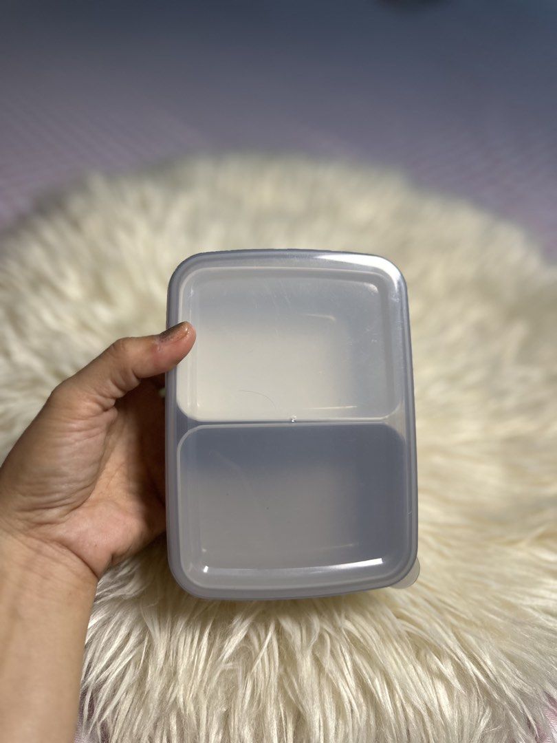 two-compartment rectangular lunch box or food container. (Category: Food Organization & Storage) located in Davao. Submitted by favoritepreloved (Listing ID 1471276717, Image 1). Description: 💜 Japan Plasticware 💜 High quality plastic 💜 14.5cm x 10.5cm x 4.5cm.