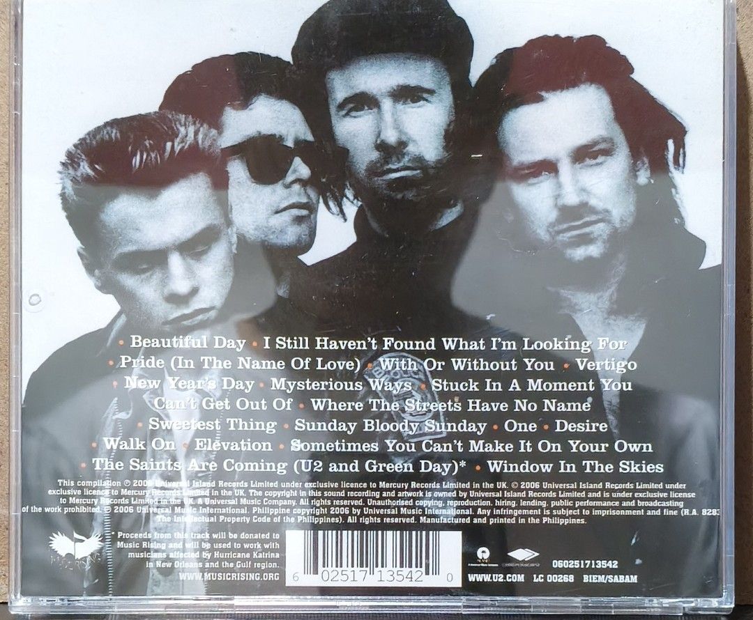 U218 Singles CD Album (Category: CDs & DVDs) located in Manila. Submitted by ruelcabrer77078 (Listing ID 1471289445, Image 3). Description: - Album: U2 Compilation (18 Tracks) - Hits included: Beautiful Day, With Or Without You, Vertigo, and more - Bonus tracks: 2 new singles including "The Saints Are Coming" (with Green Day) and "Window In The Skies" - Inclusions: Original jewel case and CD - Condition: Well-maintained - Shipping: Nationwide via