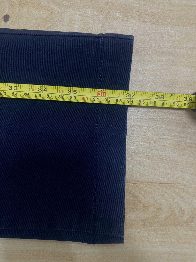 UNIQLO PANTS CHINO (Category: Chinos) located in Baguio. Submitted by dmnddnmd (Listing ID 1471184207, Image 3). Description: - Brand: Uniqlo - Color: Dark blue - Material: 97% cotton, 3% spandex (comfortable stretch) - Size: Waist 82cm / SIZE 30-32 - Design: Flat front with button closure and belt loops - Measurements: ~37 inches total length, ~7 inches leg opening.