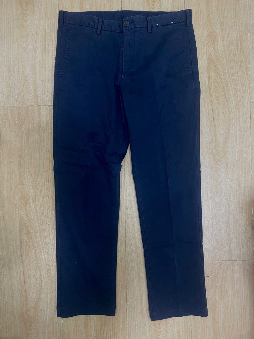 UNIQLO PANTS CHINO (Category: Chinos) located in Baguio. Submitted by dmnddnmd (Listing ID 1471184207, Image 1). Description: - Brand: Uniqlo - Color: Dark blue - Material: 97% cotton, 3% spandex (comfortable stretch) - Size: Waist 82cm / SIZE 30-32 - Design: Flat front with button closure and belt loops - Measurements: ~37 inches total length, ~7 inches leg opening.