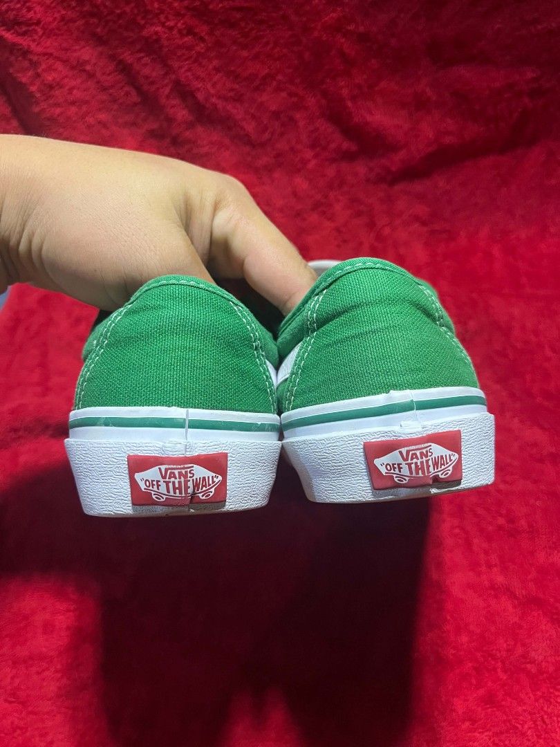 Vans Green Canvas Low Top Sneakers (Category: Sneakers) located in General Santos City (Dadiangas). Submitted by vashcollection16 (Listing ID 1471275147, Image 3). Description: - Color: Green canvas with white side stripe and laces - Style: Classic low-top skater shoes - Details: Red Vans Off The Wall heel patch - Soles: White rubber midsole with classic waffle outsole - Condition: Clean soles with minimal signs of wear on treads.
