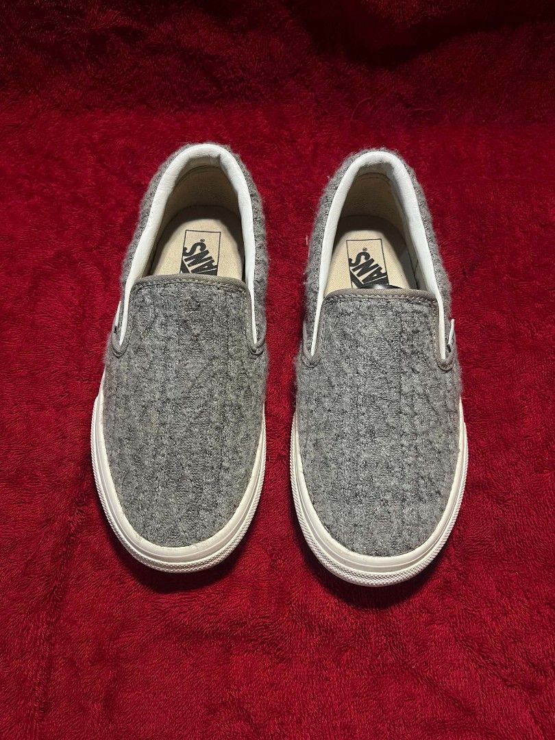 Vans Grey Textured Knit Slip-On Sneakers (Category: Sneakers) located in General Santos City (Dadiangas). Submitted by vashcollection16 (Listing ID 1471275461, Image 2). Description: - Brand: Vans - Style: Slip-on with textured grey knit upper - Soles: Classic waffle rubber outsole showing practically no wear - Details: White midsole trim, red 'Off The Wall' heel tab, and clean white interior lining - Condition: Excellent, barely worn - Feature: 