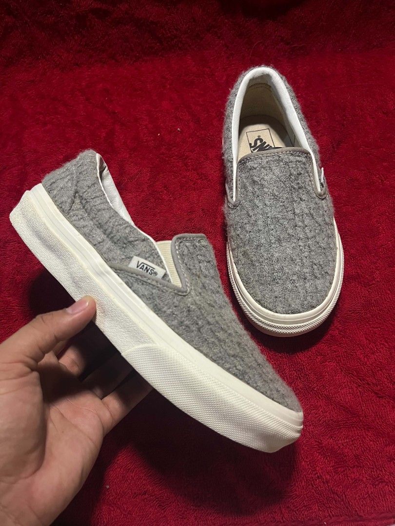 Vans Grey Textured Knit Slip-On Sneakers (Category: Sneakers) located in General Santos City (Dadiangas). Submitted by vashcollection16 (Listing ID 1471275461, Image 3). Description: - Brand: Vans - Style: Slip-on with textured grey knit upper - Soles: Classic waffle rubber outsole showing practically no wear - Details: White midsole trim, red 'Off The Wall' heel tab, and clean white interior lining - Condition: Excellent, barely worn - Feature: 