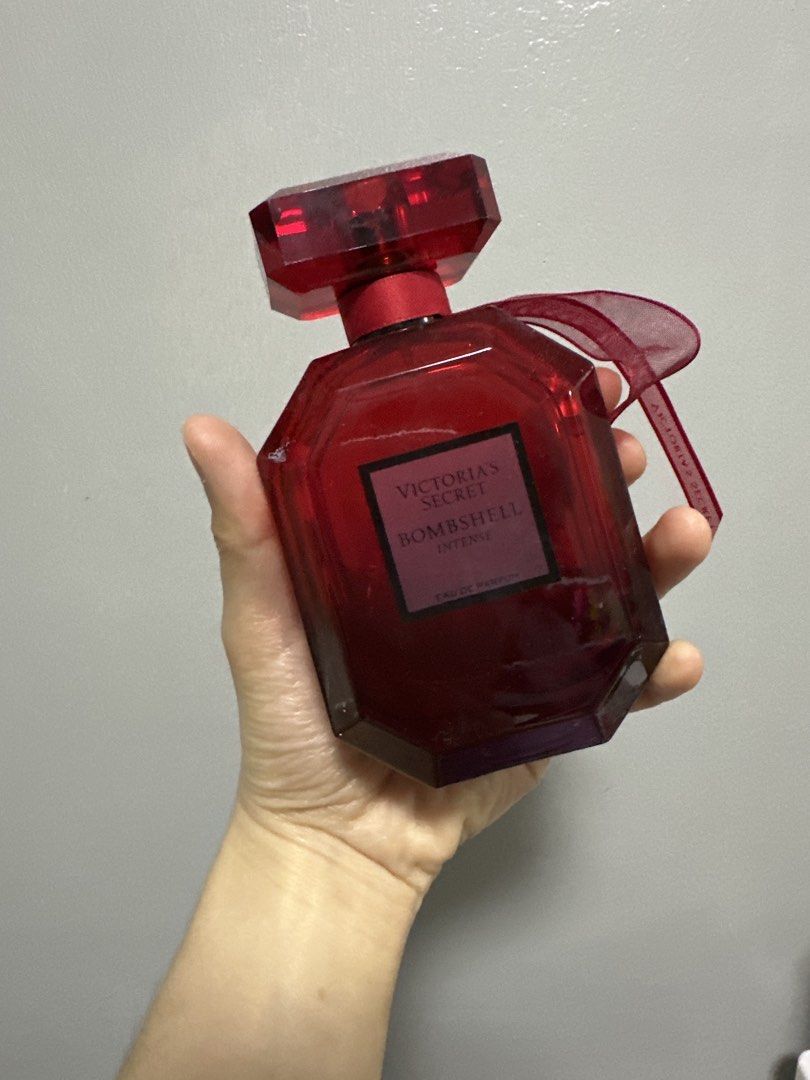 Victoria's Secret Bombshell Intense Eau de Parfum (Category: Fragrance & Deodorants) located in San Juan City. Submitted by declutterwithxz (Listing ID 1471154148, Image 1). Description: - Authentic Victoria's Secret Bombshell Intense fragrance - Gorgeous red glass bottle with a red cap and sheer red ribbon detail - Features the signature square label with pinkish lettering - 60%, guaranteed fresh and well-kept - Perfect for daily wear or special