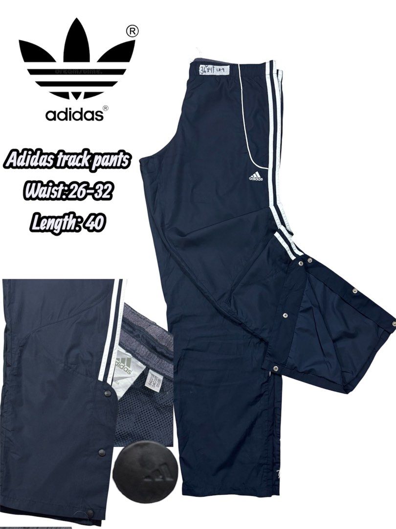 Vintage Adidas Track Pants Snap Button Sides (Category: Joggers) located in Cavite. Submitted by sidirvinp76902 (Listing ID 1471207989, Image 1). Description: - Brand: Adidas - Color: Navy blue with classic white stripes - Features: Full snap buttons along the legs for easy styling, inner mesh lining - Fit: Elastic waistband (fits waist sizes 26 to 32) - Length: 40 inches.