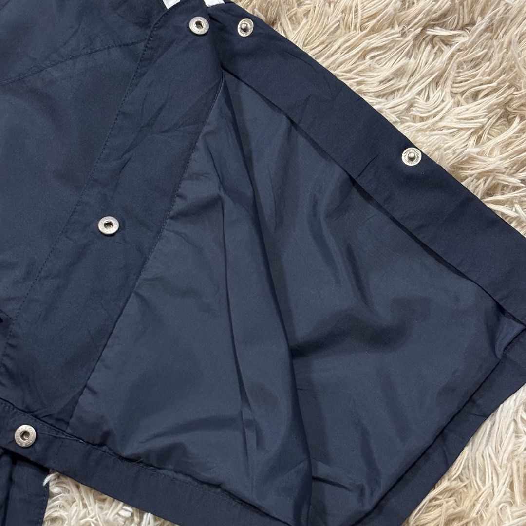 Vintage Adidas Track Pants Snap Button Sides (Category: Joggers) located in Cavite. Submitted by sidirvinp76902 (Listing ID 1471207989, Image 3). Description: - Brand: Adidas - Color: Navy blue with classic white stripes - Features: Full snap buttons along the legs for easy styling, inner mesh lining - Fit: Elastic waistband (fits waist sizes 26 to 32) - Length: 40 inches.