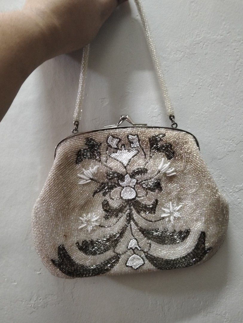Vintage Beaded Handbag with Floral Pattern (Category: Shoulder Bags) located in Gasan. Submitted by AngeliqueKaye (Listing ID 1471210481, Image 3). Description: - Stunning vintage-style evening bag with intricate floral embroidery - Metallic silver and white beads on a chic light champagne base - Secure metal kiss-lock top closure - Features a convenient single beaded top handle - Compact size: comfortably fits your phone, lipstick, and keys - Pe