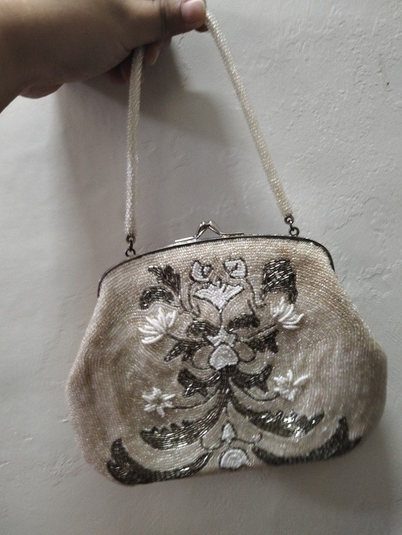 Vintage Beaded Handbag with Floral Pattern (Category: Shoulder Bags) located in Gasan. Submitted by AngeliqueKaye (Listing ID 1471210481, Image 1). Description: - Stunning vintage-style evening bag with intricate floral embroidery - Metallic silver and white beads on a chic light champagne base - Secure metal kiss-lock top closure - Features a convenient single beaded top handle - Compact size: comfortably fits your phone, lipstick, and keys - Pe