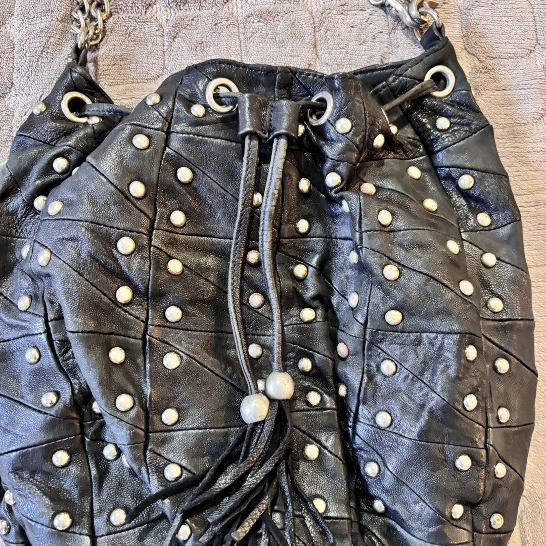 Vintage Full Studded Bucket Bag (Category: Shoulder Bags) located in Imus. Submitted by wear.arca (Listing ID 1471143487, Image 3). Description: Flaws: Some tarnishing on studs No tarnishing on chain strap Can fit a lot No flaws on body.