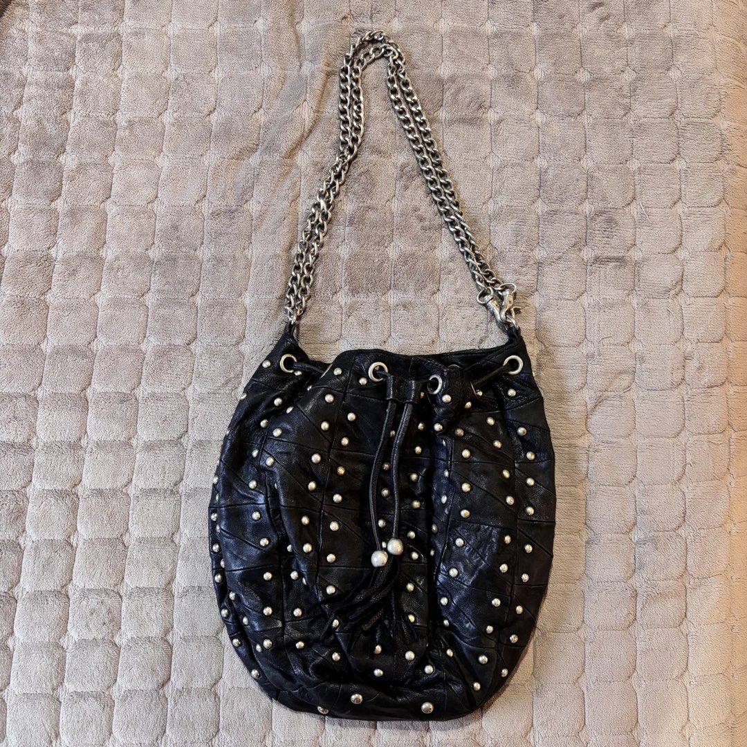 Vintage Full Studded Bucket Bag (Category: Shoulder Bags) located in Imus. Submitted by wear.arca (Listing ID 1471143487, Image 1). Description: Flaws: Some tarnishing on studs No tarnishing on chain strap Can fit a lot No flaws on body.