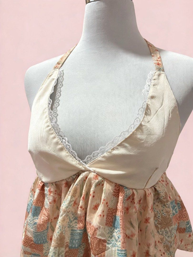 Vintage Patchwork Halter Top with Lace Trim (Category: Sleeveless) located in Koronadal. Submitted by ciara_12 (Listing ID 1471271021, Image 2). Description: Chic cream halter top featuring a low V-neck with white lace trim, an open back, and a flowy peach, teal, and brown patchwork hem. Soft, comfortable, and ties at the neck..