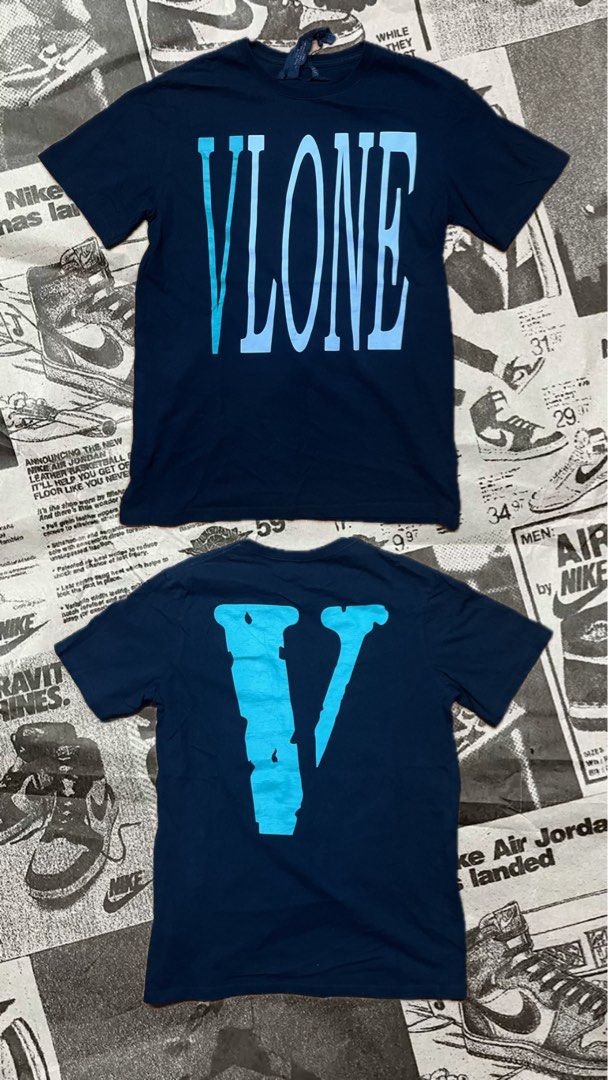Vlone Blue Logo T-shirt (Category: Tshirts & Polo Shirts ) located in Manila. Submitted by jlfamiliar69452 (Listing ID 1471146809, Image 1). Description: - Brand: Vlone - Color: Dark Navy Blue with light blue lettering - Size: Medium (M) - Design: Classic front print and signature large V graphic on the back - Authenticity: Includes interior Vlone neck tag and wash tag with holographic security sticker - Material: Clean, comfortable cotton - Cond