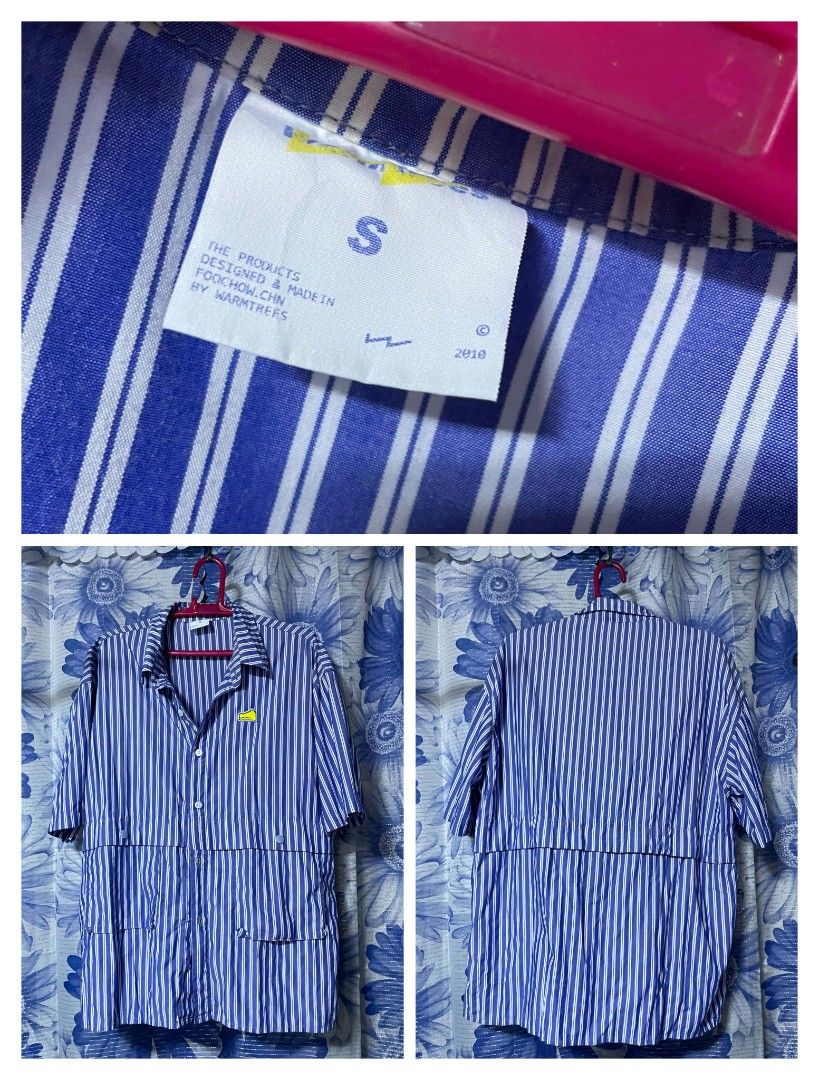 Warmtrees Blue Striped Short Sleeve Button Down Shirt Size S (Category: Tshirts & Polo Shirts ) located in Manila. Submitted by arimad.clo (Listing ID 1471168591, Image 1). Description: - Brand: Warmtrees - Style: Blue and white vertical striped short sleeve shirt with button-down front and collar - Details: Features lower front pockets and button accents - Size: S (tag on collar) - Origin: Made in Foochow - Fit: Relaxed fit with lightweight fabr