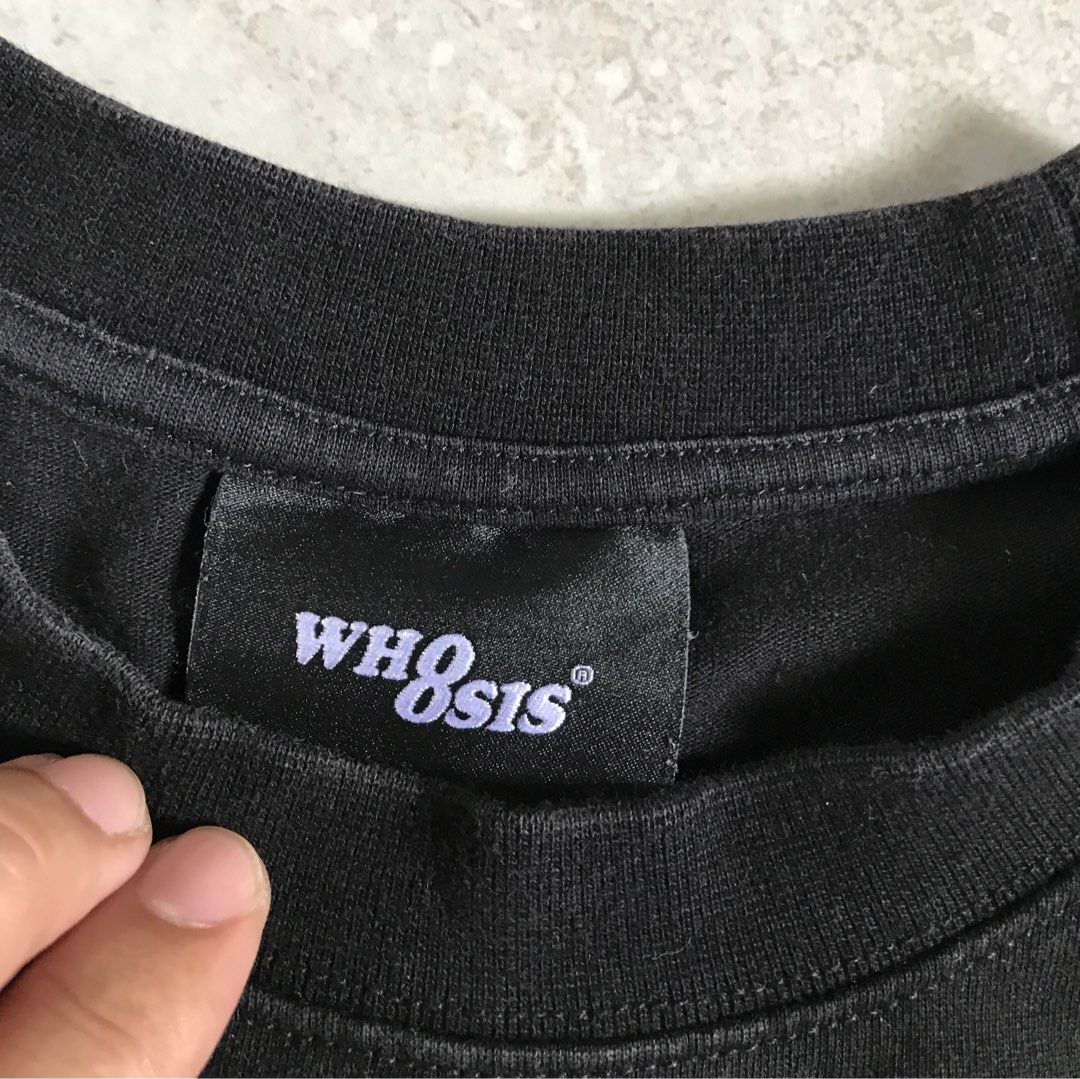 WH8SIS Black Graphic T-Shirt (Category: Tshirts & Polo Shirts ) located in Banga. Submitted by jorguarino (Listing ID 1471140876, Image 2). Description: - Brand: WH8SIS - Color: Black - Material: 100% Cotton - Design: Large pink sparkly graphic print with grid and starburst patterns - Neckline: Standard crew neck - Details: Includes neckline tag and interior care label - Origin: Made in China.