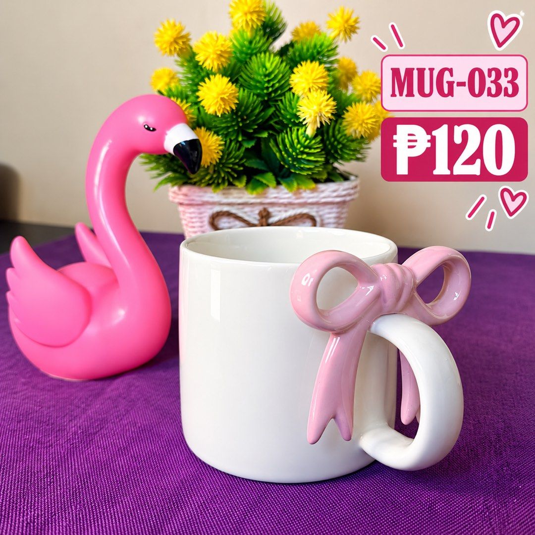 White Ceramic Mug with Pink Bow Handle MUG-033 (Category: Coffee & Tea Tableware) located in Manila. Submitted by zamarah08 (Listing ID 1471209045, Image 1). Description: - Model: MUG-033 - Material: White ceramic with a smooth glazed finish - Design: Cute pastel pink bow wrapped around the handle - Ideal for: Daily coffee, tea, or as a aesthetic desk/kitchen decor - Condition: Clean interior, brand new look.