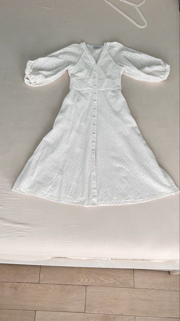 White Eyelet Midi Dress (Category: Dresses) located in Kawit. Submitted by apuchiko (Listing ID 1471147567, Image 2). Description: Bought from another trusted carousell shop where she used this once for a photoshoot. I used also once to a birthday party 😄 This is really pretty. Very much like Korean style. Size: small (bust 33, waistline 28, length 45.5 inches). Since I'm not into dresses, hence selling this..