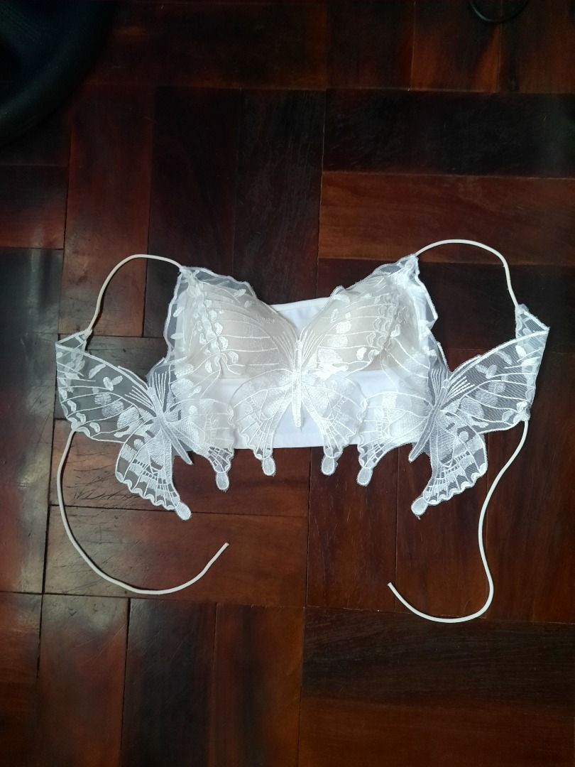 White lace butterfly crop top (Category: Sleeveless) located in Angeles City. Submitted by Vermilionsky (Listing ID 1471169567, Image 2). Description: - Color: White with nude padding - Style: crop top with butterfly lace -Stretchy- fits XS-S - Best for: Music festivals, sunny days out, and trendy casual looks.