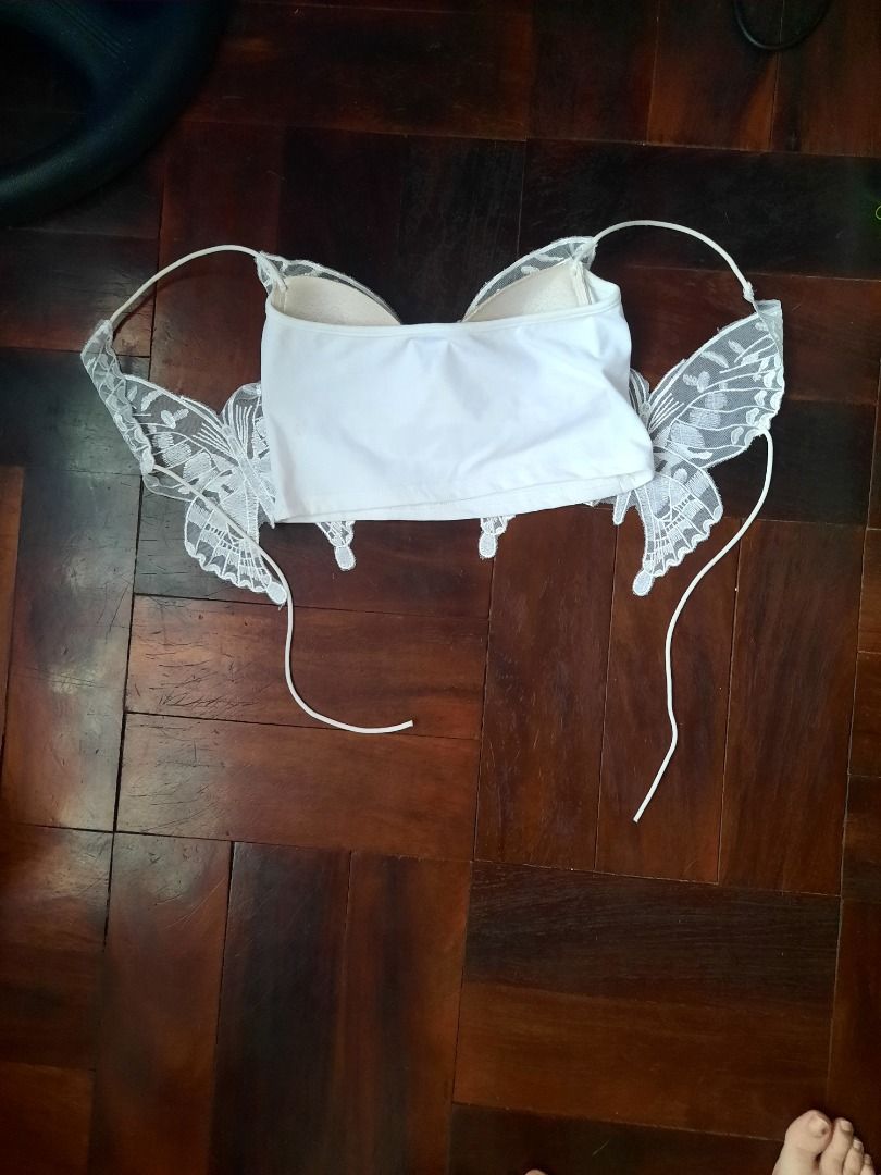 White lace butterfly crop top (Category: Sleeveless) located in Angeles City. Submitted by Vermilionsky (Listing ID 1471169567, Image 3). Description: - Color: White with nude padding - Style: crop top with butterfly lace -Stretchy- fits XS-S - Best for: Music festivals, sunny days out, and trendy casual looks.