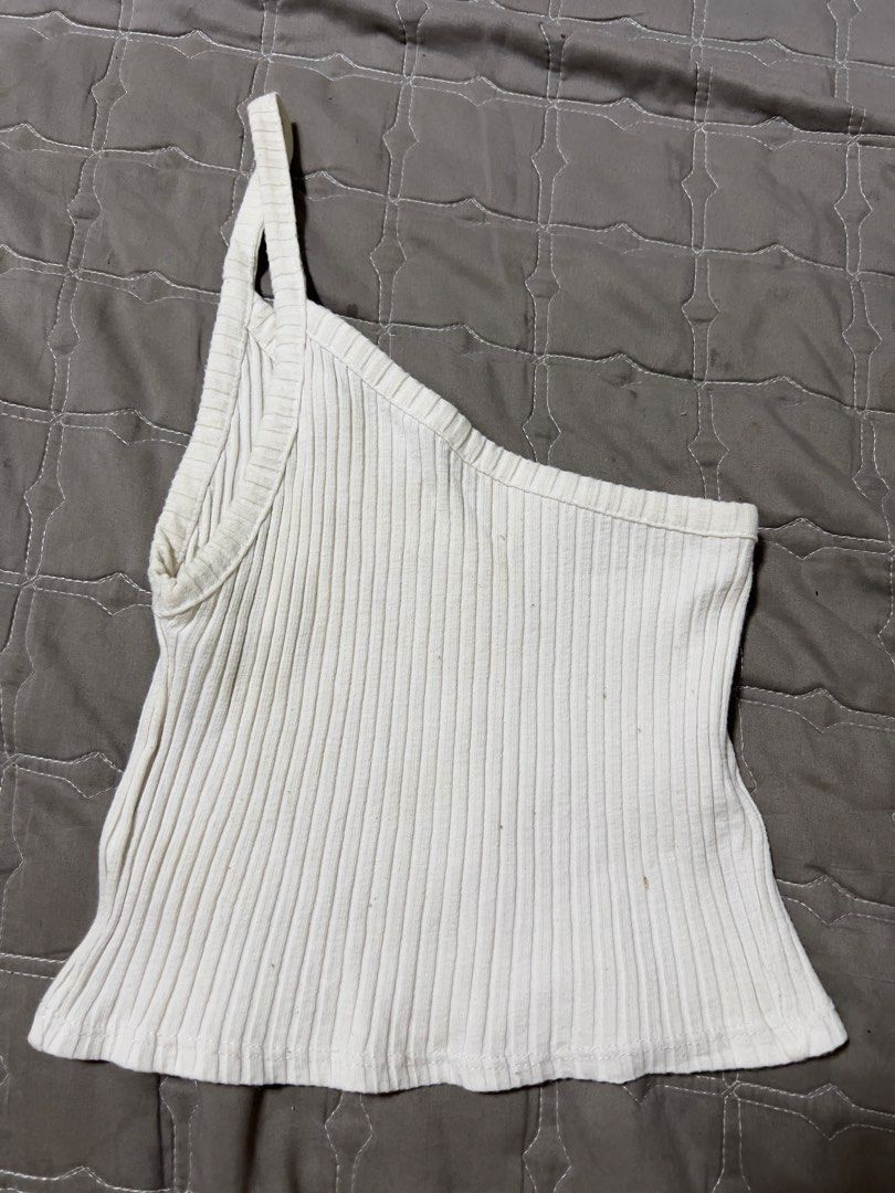 White One-Shoulder Ribbed Tank Top (Category: Sleeveless) located in Bacolod City. Submitted by strawberrymochi1201 (Listing ID 1471258722, Image 1). Description: - Color: White - Design: Chic one-shoulder strap with a trendy crop length - Material: Stretchy, ribbed knit fabric that hugs your curves - Styling: Pairs effortlessly with high-waisted jeans or skirts - Condition: Brand new / Excellent - Perfect for: Casual outings, daily wear, and str