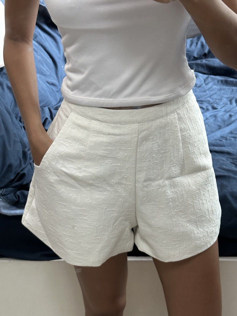 White textured high-waisted shorts with pockets (Category: Shorts) located in Quezon City. Submitted by valeriorac74670 (Listing ID 1471174568, Image 2). Description: - Color: White with a subtle woven geometric pattern - Fit: High-waisted with front pleats and side pockets - Style: Clean tailoring for a crisp, polished look - Condition: Worn once, still in great shape, clean and ready to wear.