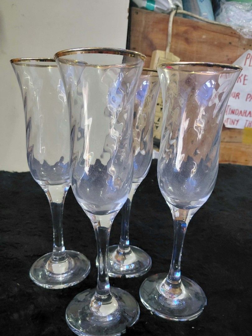 Wine glasses (Category: Wine Cellar & Storage) located in Manila. Submitted by rubymielbona (Listing ID 1471176177, Image 1). Description: - Elegant wine glasses featuring a stylish gold rim detail - Textured glass body design for a classy and unique look - Perfect for wine, champagne, or special celebrations - Clear glass material that complements any dining setup - Ideal for home use, parties, or gifting.