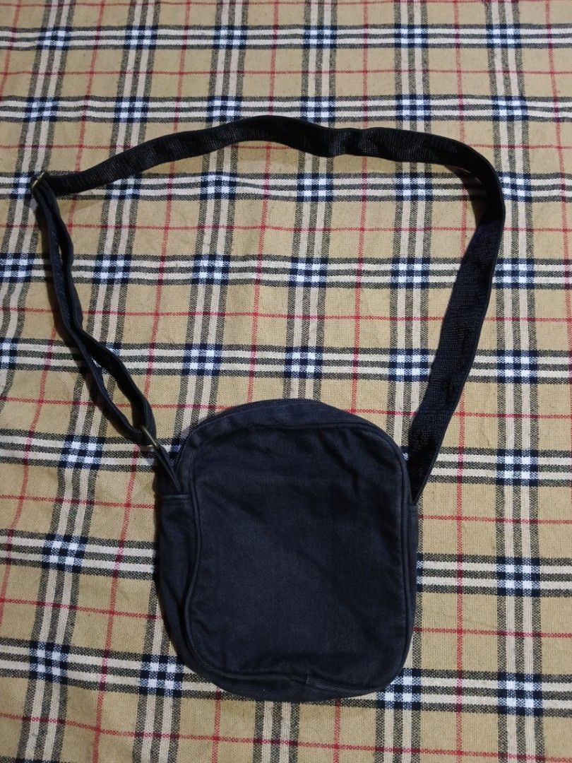 Xlarge Plaid Crossbody Bag (Category: Activewear) located in General Santos City (Dadiangas). Submitted by freehorse.5f2a61 (Listing ID 1471226332, Image 2). Description: - Brand: Xlarge - Design: Black and grey plaid sling bag - Strap: Adjustable black strap with durable metal hardware - Pockets: Front zipped pocket, main compartment, and an inner zip pocket - Storage: Ideal size for daily essentials like phone, keys, and wallet - Condition: Goo